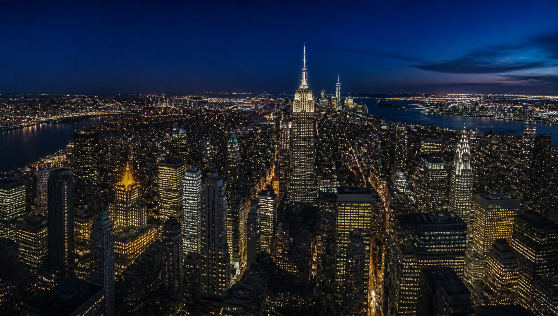 Panoramic aerial view of the New York City skyline at night